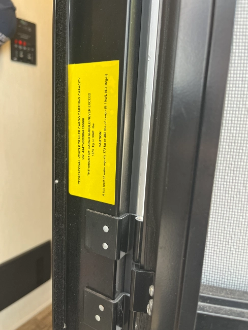  Yellow VIN sticker located inside the RV entry door—common placement for camper VIN numbers.

