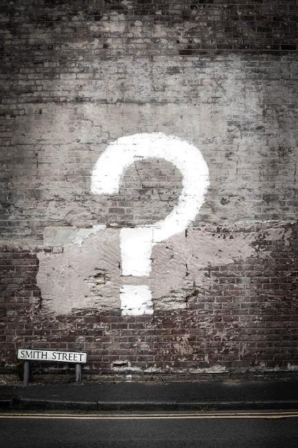  Question mark painted on a brick wall—used in the section explaining what an RV monitor panel is.

