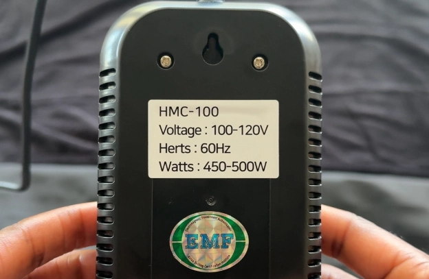 EMF certification label and voltage specifications on the back of HigherDose infrared sauna blanket controller.