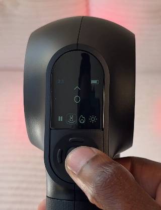Close up of the Theragun PRO Plus OLED screen showing therapy mode icons.