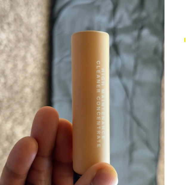 HigherDose High Maintenance cleaner spray and concentrate placed on sauna blanket surface.