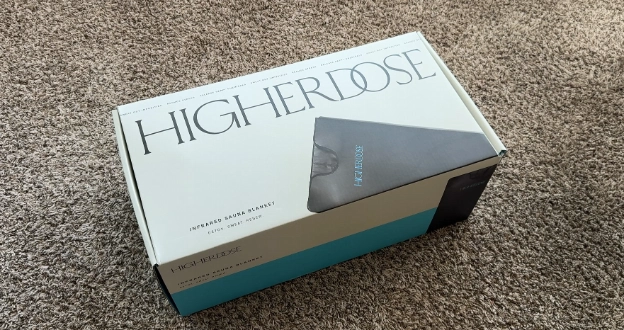 HigherDose infrared sauna blanket unboxed and showing packaging design and branding.