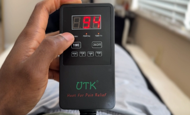 UTK PEMF infrared healing mat digital remote showing frequency and heat settings