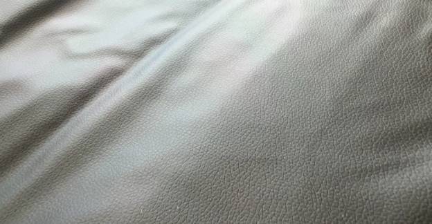 HigherDose infrared sauna blanket close-up showing non-toxic polyurethane leather material texture.