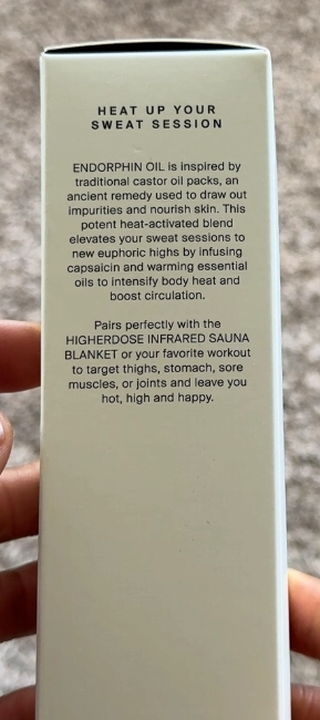 HigherDose Endorphin Oil bottle used with infrared sauna blanket to boost heat and sweat response.