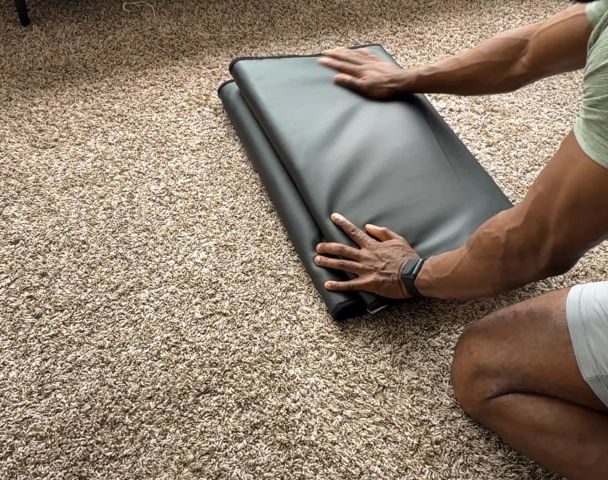 Folding the UTK PEMF infrared healing mat for easy storage at home