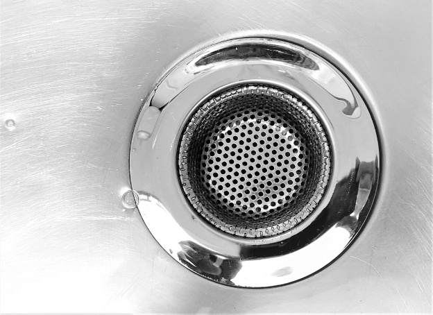 cleaning a bathroom drain