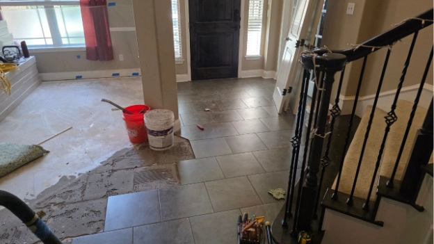 tile removal in progress in foyer area
