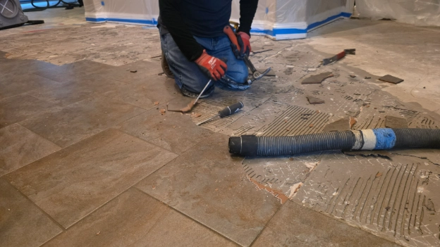 Removing tile by hand 