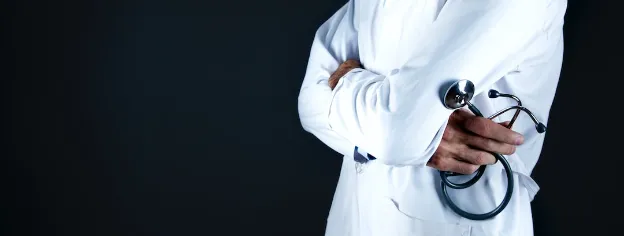 doctor coat holding stethoscope