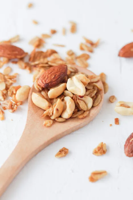nuts on a wooden spoon