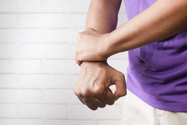 grasping wrist in pain