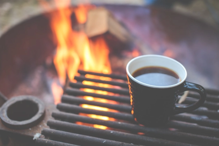 image of a coffee cup on a campfire