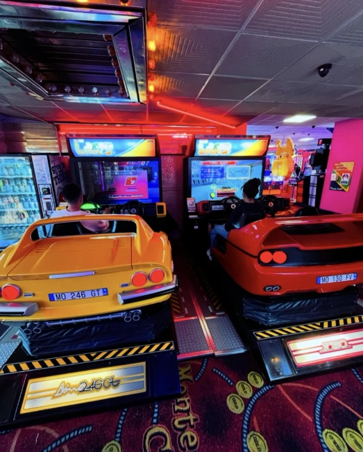 My children at a Southend arcade — school holiday fun as a work-from-home Virtual Assistant.
