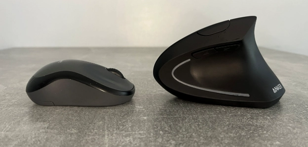Standard mouse compared with the Anker vertical ergonomic mouse showing the difference in shape.