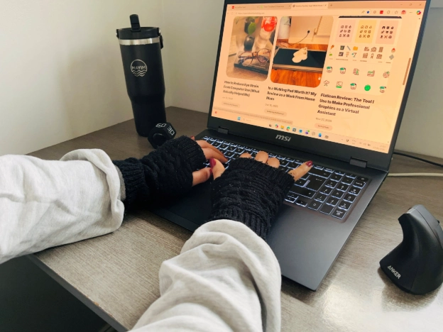 Fingerless gloves for typing worn while working from home, keeping hands warm without affecting keyboard use.