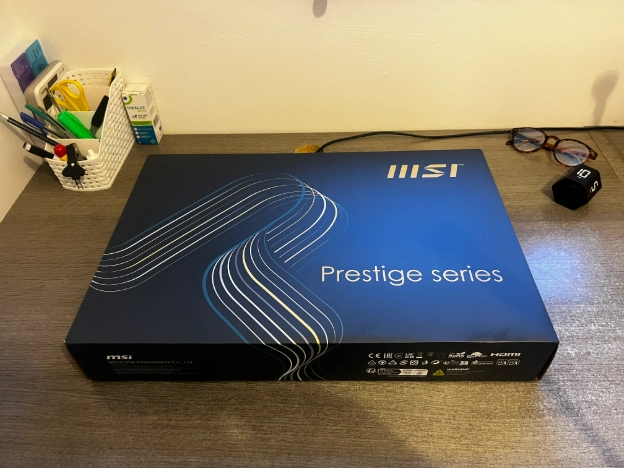 MSI Prestige 16 AI+ Evo laptop box on a desk before setup for work from home and freelance use.
