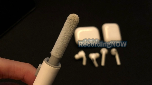 Cleaning AirPods and AirPods Pro 2 case from ear wax using soft brush cleaning tool