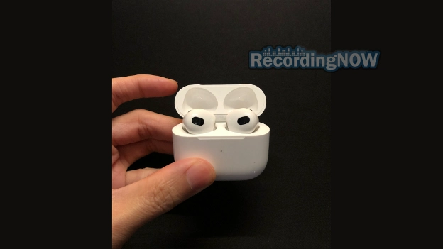 Holding AirPods 3rd generation with MagSafe Charging Case