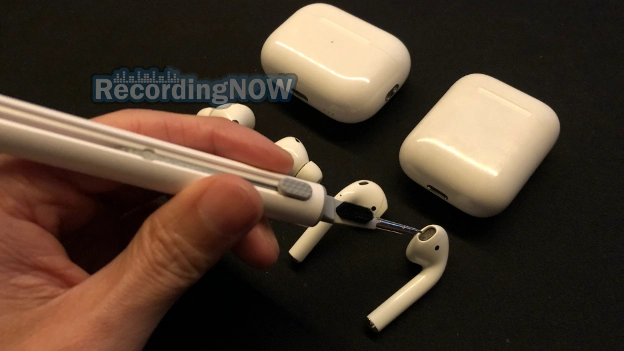 Cleaning AirPods mesh from ear wax using tool