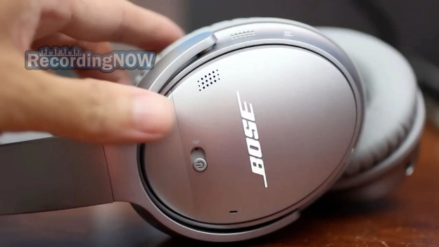 Holding Bose QC35 II silver in hand