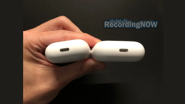 Holding AirPods 2nd gen lightning charging case next to 3rd gen MagSafe charging case