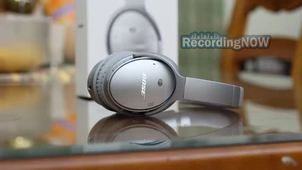 Side profile of Bose QC35 II silver on glass table