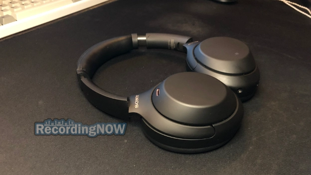 Sony WH-1000XM4 headphones laying flat on desk