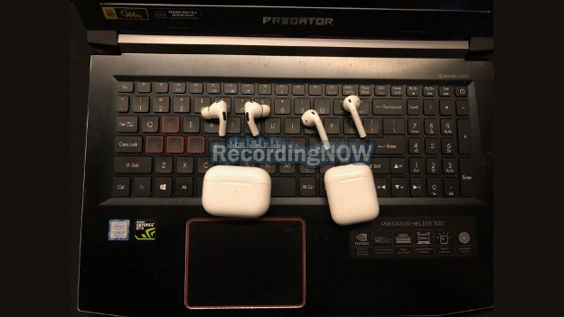 AirPods Pro 2 and AirPods 2nd generation on keyboard of Windows 11 Laptop PC