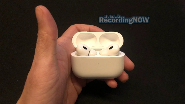 Holding AirPods Pro 2 USB C wireless charging case