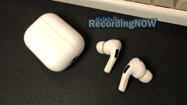 Apple AirPods Pro 2 next to USB C charging case