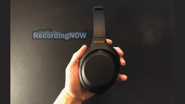 Holding earcup of Sony WH-1000XM4 in hand