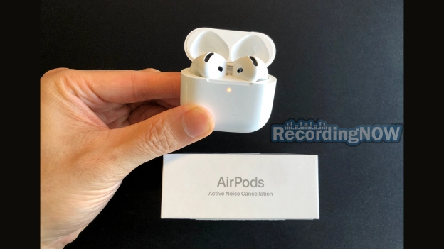 Holding AirPods 4 ANC in charging case