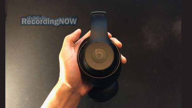 Holding Beats Studio Pro headphone earcup in hand