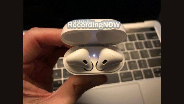 AirPods 2nd generation in Bluetooth pairing mode with white flashing LED light inside of charging case