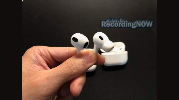 Holding AirPods Pro 2 vs AirPods 3 wireless earbuds side by side in hand