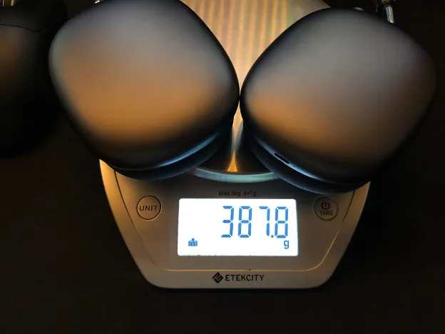 Apple AirPods Max on scale weighing 387.8 grams