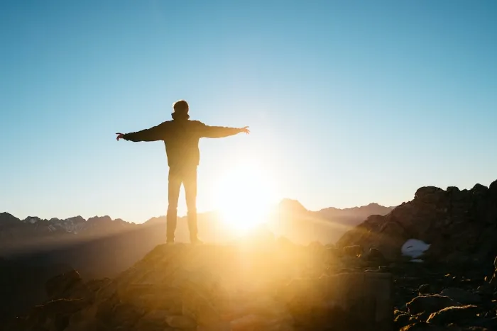 man greeting sunrise