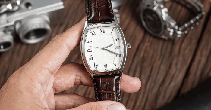 Image of a dress watch with brown leather strap attached to it