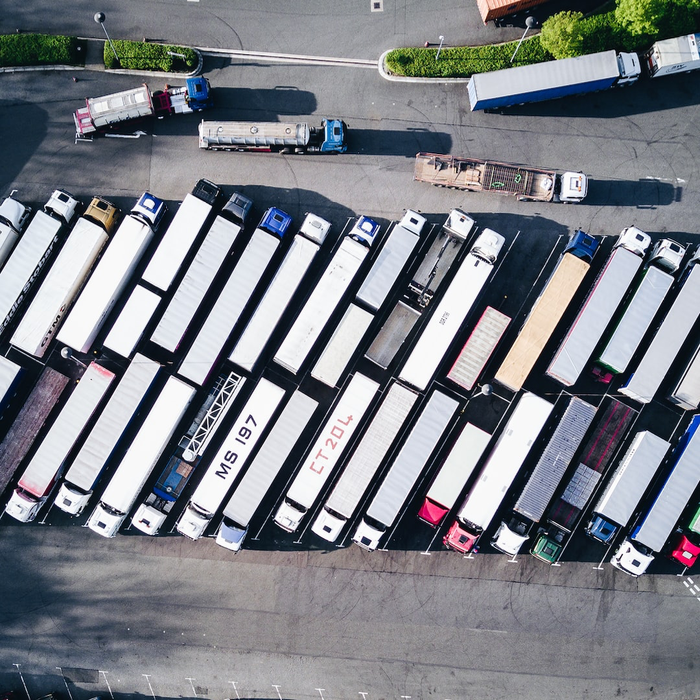 Semi trucks parked in a parking lot