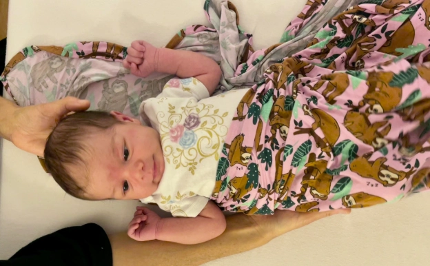 Baby receiving craniosacral therapy, an important newborn bodywork method for all babies.